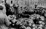 Yitzhak Zuckerman delivers a speech at a ceremony in front of the ruins of the former headquarters of the Warsaw ghetto Jewish council [probably to mark the fourth anniversary of the Warsaw ghetto uprising].