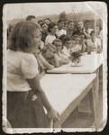 Jewish youth living at the "Farma" Zionist agricultural collective, attend a meeting.