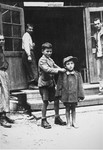 Children survivors stand in front of a barracks in the newly liberated Ebensee concentration camp.