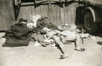 A former prisoner lies outside a barracks in the newly liberated Ebensee concentration camp.