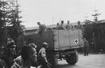 Evacuating survivors from Ebensee to the 139th Evacuation Hospital for medical care.