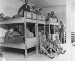 Survivors lie on bunks in the infirmary barracks for Jewish prisoners in the Ebensee concentration camp.