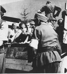 German soldiers assist in evacuating survivors from Ebensee to the 139th Evacuation Hospital for medical care after liberation.