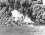 Smoke billows out from U.S. ships hit during the Japanese air attack on Pearl Harbor.