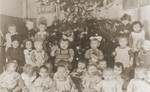 Group portrait of children celebrating Christmas at a Polish orphanage (Dom Dziecka) in Czestochowa.