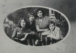 Studio portrait of the Edelstein family.

Top row, right to left: two cousins, Freedah Edelstein and Liebaleh Belicki; leaning on her cousin Rochella Belicki, and sitting on the left is Batsheva Edelstein, a sister of Freedah.