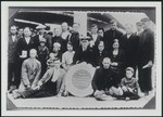 The father of Avraham Aviel poses on the deck of a ship along with other passengers while on route to South America.