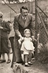 Adolf Hitler with an unidentified German child.
