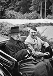 German President Paul von Hindenburg rides in an open car with Adolf Hitler, the newly appointed Chancellor.
