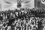 Hitler receives an ovation from the Reichstag for the "Anschluss" with Austria.