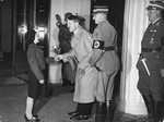 Adolf Hitler greets the daughter of General Karl-Siegfried Litzmann at a Nazi Party convention.