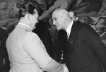 Reich Minister Hermann Goering greets Wilhelm Frick, the German Minister of the Interior, at an official public function.