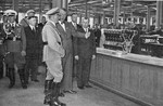 Franz-Josef Popp, Director General of Bayrischen Motorenwerken (BMW) gives Adolf Hitler a tour of a factory.