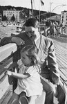 Hitler plays with young Helga Goebbels at the waterfront.