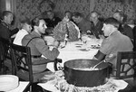 Adolf Hitler and Joseph Goebbels share a meal on "Eintopf Sonntag."  

One Sunday a month, Germans ate a one-pot meal and contributed the savings to public charities.