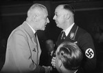 Reichsminister of the Interior Wilhelm Frick greets Heinrich Himmler at a "Friendship Evening" for Reichstag delegates.