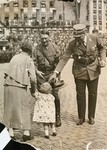 A little girl presents flowers to Hitler during a Reichsparteitag (Reich Party Day) celebration in Nuremberg.