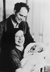 Irmgard and Josef Koeppel hold their infant daughter Judith.