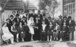 Portrait of an extended Jewish family at a wedding in Galanta, Slovakia.