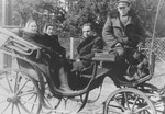Itzhak Granek (second from right) rides in a horse-drawn carriage during his stay in the resort town of Zakopane.