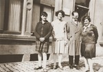 Charlotte Michel poses with members of the Hayum family outside on a street in Luxembourg.