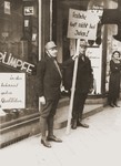 Members of the SA block the entrance to the Jewish-owned Erwege store on Fackelstrasse to enforce the April 1 boycott of Jewish businesses.