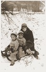 Shulamit Rabinovitch goes sledding with her sons Amos and Binyamin.