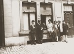 A group of young Jewish men and women pose outside on a street in Luxembourg.