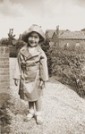 Suse Grunbaum poses in a raincoat one year after her family's arrival in the Netherlands.