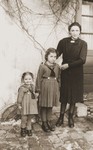 Irene Ripp Keller and her daughters Elvira and Mira in their back yard.