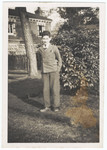 Theo Markus Verderber poses on the grounds of the Sherrads boys' hostel after arriving in England on a Kindertransport from Zbaszyn, Poland.