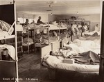 Survivors in a tuberculosis ward set up in Dachau by the U.S.