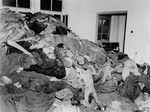 Corpses piled in the crematorium mortuary.  These rooms became so full of bodies that the SS staff and survivors began piling them behind the crematorium, where they were found by U.S.