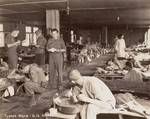 American medical personnel at work in a typhus ward in a hospital for Dachau survivors.