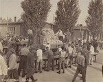 Survivors in Dachau distribute bread to their comrades after liberation.