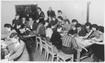 Women study pattern-making in a sewing class in the ORT vocational school at Zeilsheim displaced persons' camp.