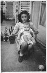 Brenda Hershkovitz holds her baby sister, Annie, on the balcony of their Paris apartment.