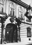 The Swiss flag hangs in front of the British Legation on Verbocsy Street in Budapest.