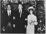 Turkish diplomat Selahatin Ulkumen poses with his son, Memet, and daughter-in-law at their wedding.