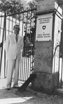 Consul Charles (Carl) Lutz poses at the gate of the "evacuation quarters" of the Swiss legation in 
Bicske, about half an hour from Budapest.