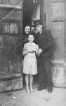 Blimcia, Aunt Esther, Vrumek and Helcia Stapler stand in the doorway of their home in the Chrzanow ghetto.