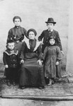 Chaya Laufer sits surrounded by her children Sara Miriam, Nachman, Esther and Abraham.