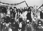 Group portrait of Jewish DPs dressed in Purim costumes at the Schlachtensee displaced persons camp.