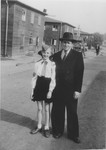 Yeshayahu Zycer (right) poses with a young girl, who is a member of the Betar Zionist youth movement, on a street in the Schlachtensee displaced persons camp.