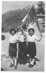 Three Jewish DPs pose with a Zionist flag in the Bad Gastein displaced persons camp.