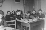 High school students at the Schlachtensee displaced persons camp study in a classroom.