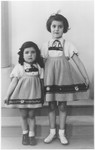 Studio portrait of Berthe and Sara Silber in matching outfits.
