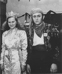 Yeshayahu Zycer poses in Purim costume with Luba Kerschenblat at the Schlachtensee displaced persons camp.