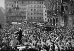 A large crowd gathers in front of the Rathaus to hear the exhortations of a Nazi orator [possibly Julius Streicher] during the "Beer Hall Putsch."