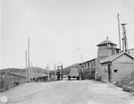 The entrance to the Natzweiler-Struthof concentration camp, which is being guarded by two members of the French resistance.